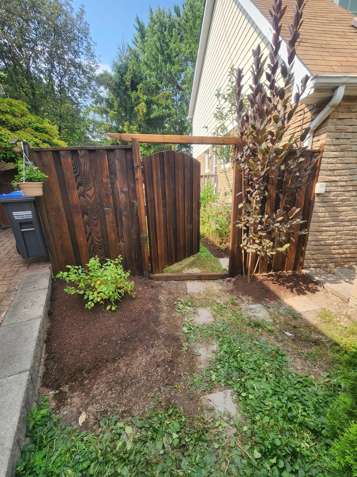 Stained cedar fence with lattice top & matching bench