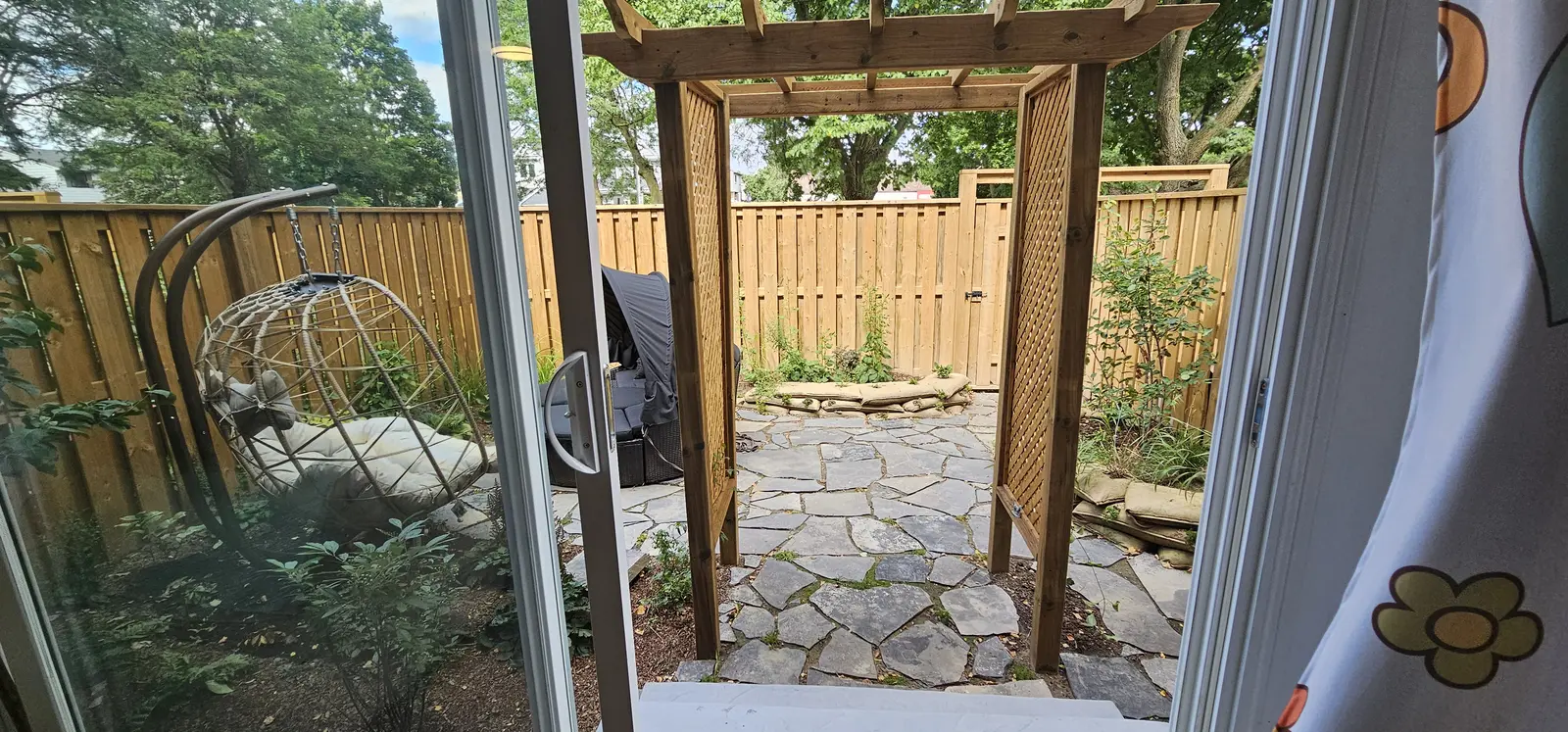 Custom pergola entry with flagstone pathway