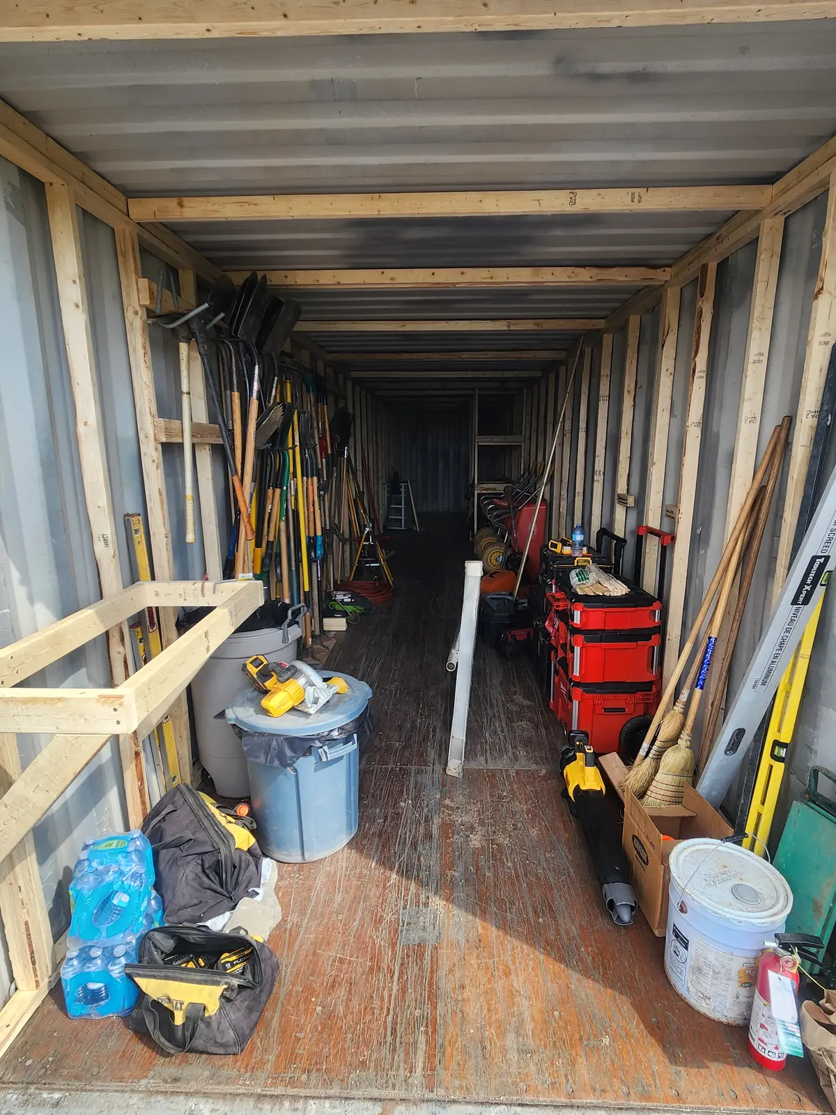 Shipping container interior with custom wood framing & shelving