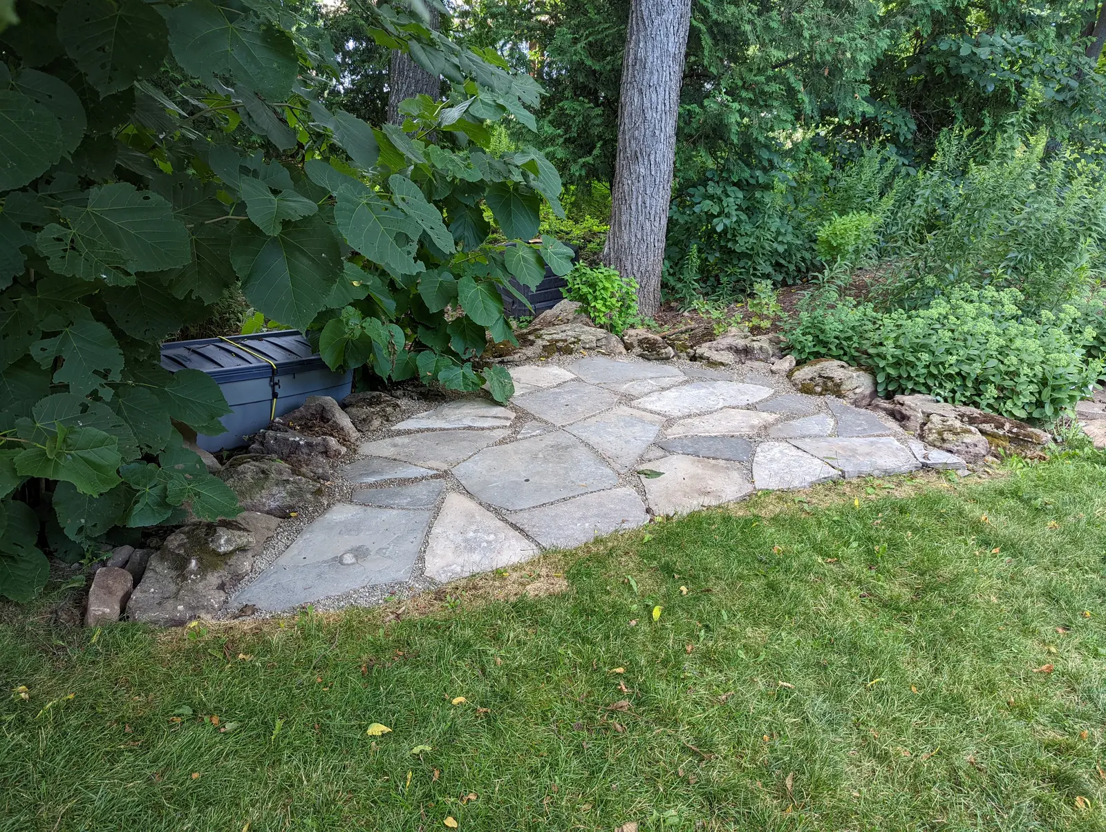 Flagstone landing pad under shade trees