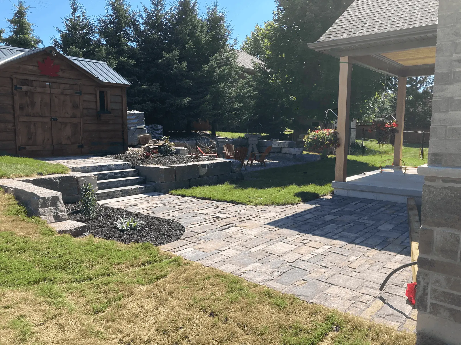 Flagstone patio with natural stone steps & retaining wall