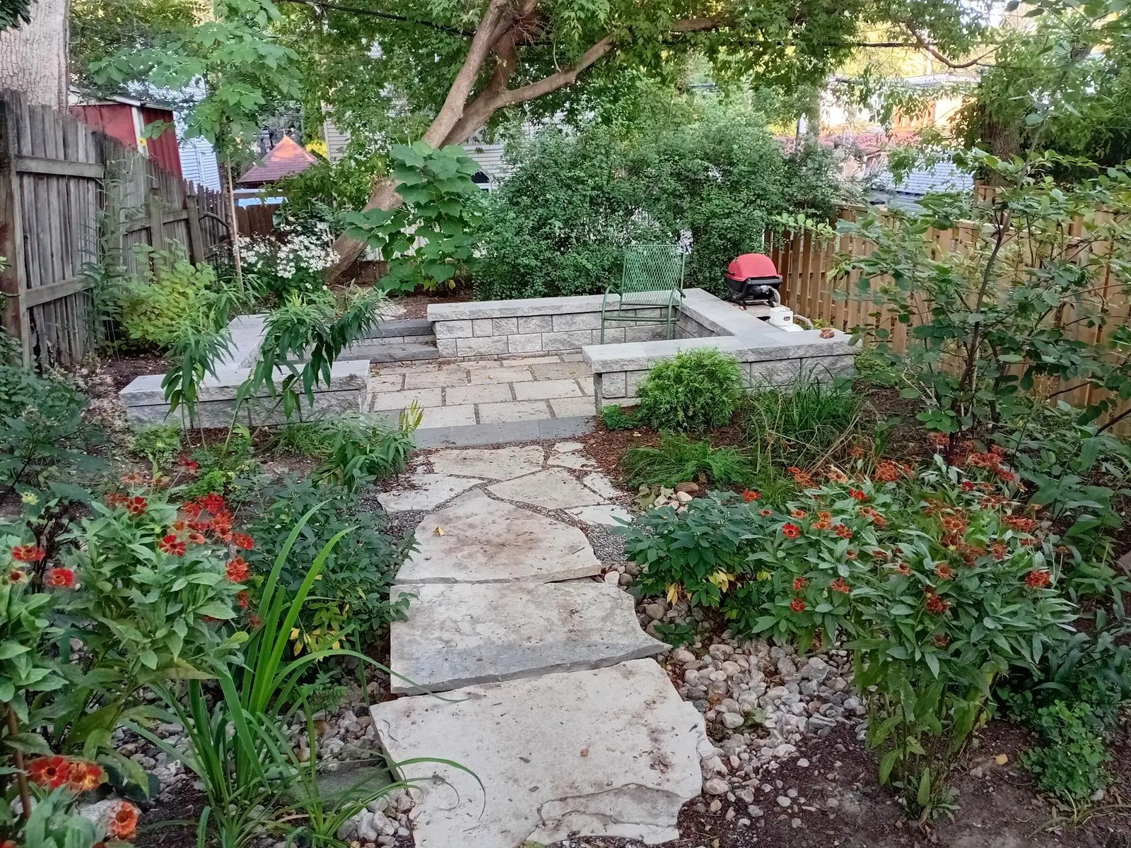 Flagstone stepping stone path through colorful native garden