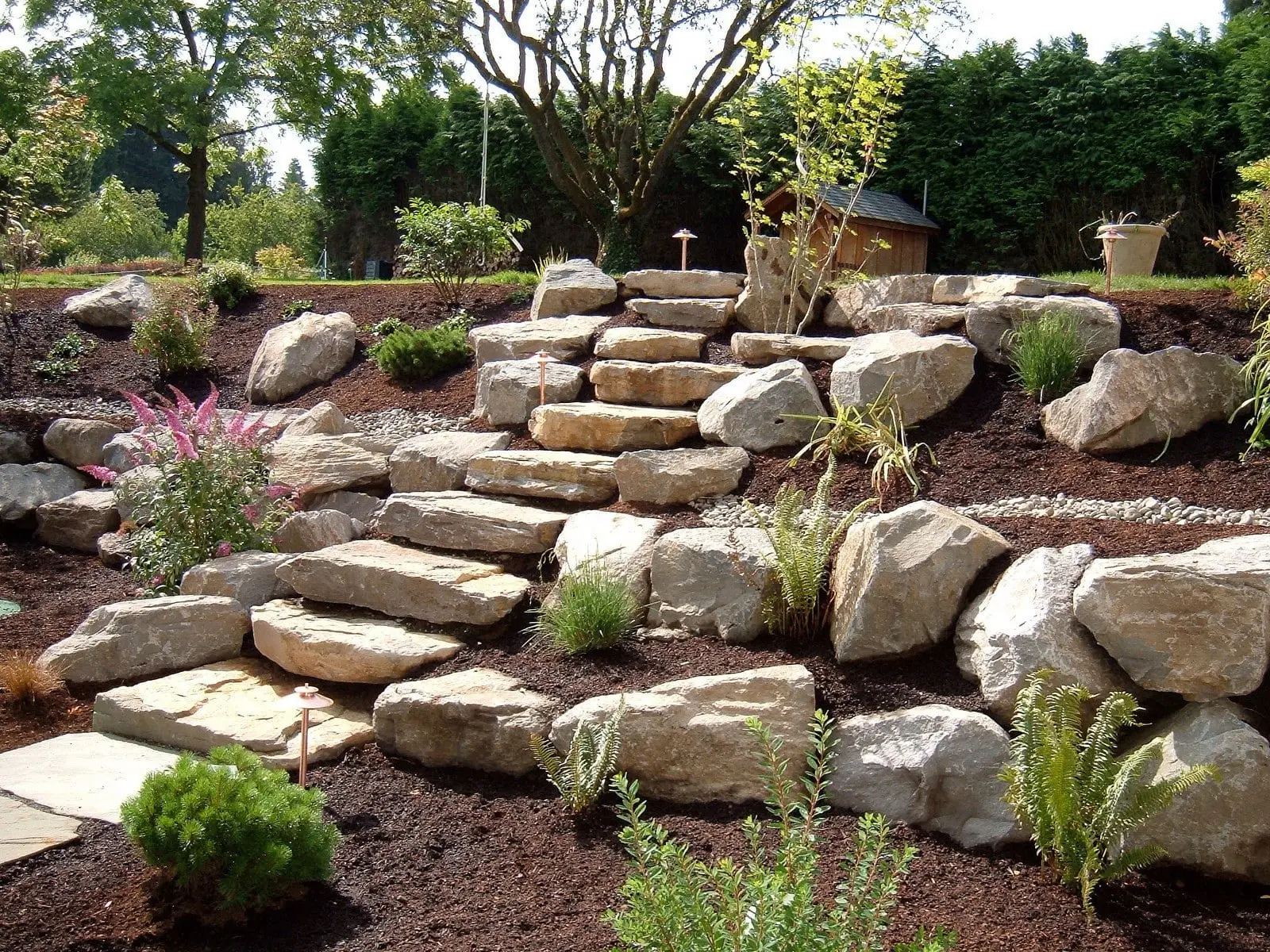 Natural stone boulder steps with perennial garden plantings