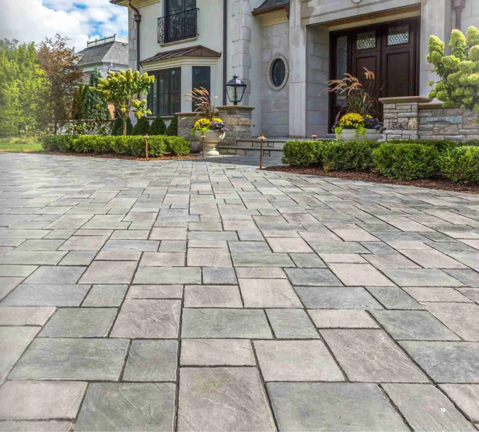 Elegant interlocking stone driveway at custom home