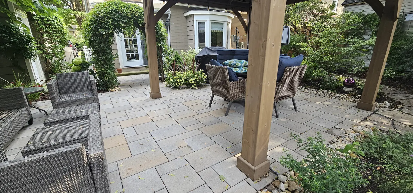 Intimate flagstone patio with pergola & seating area