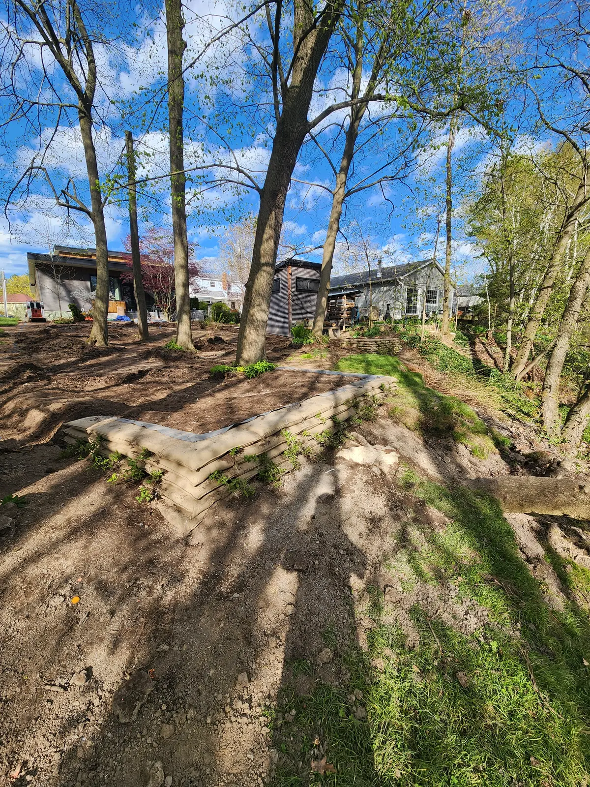 EnviroLok living wall along sloped hillside with early spring vegetation
