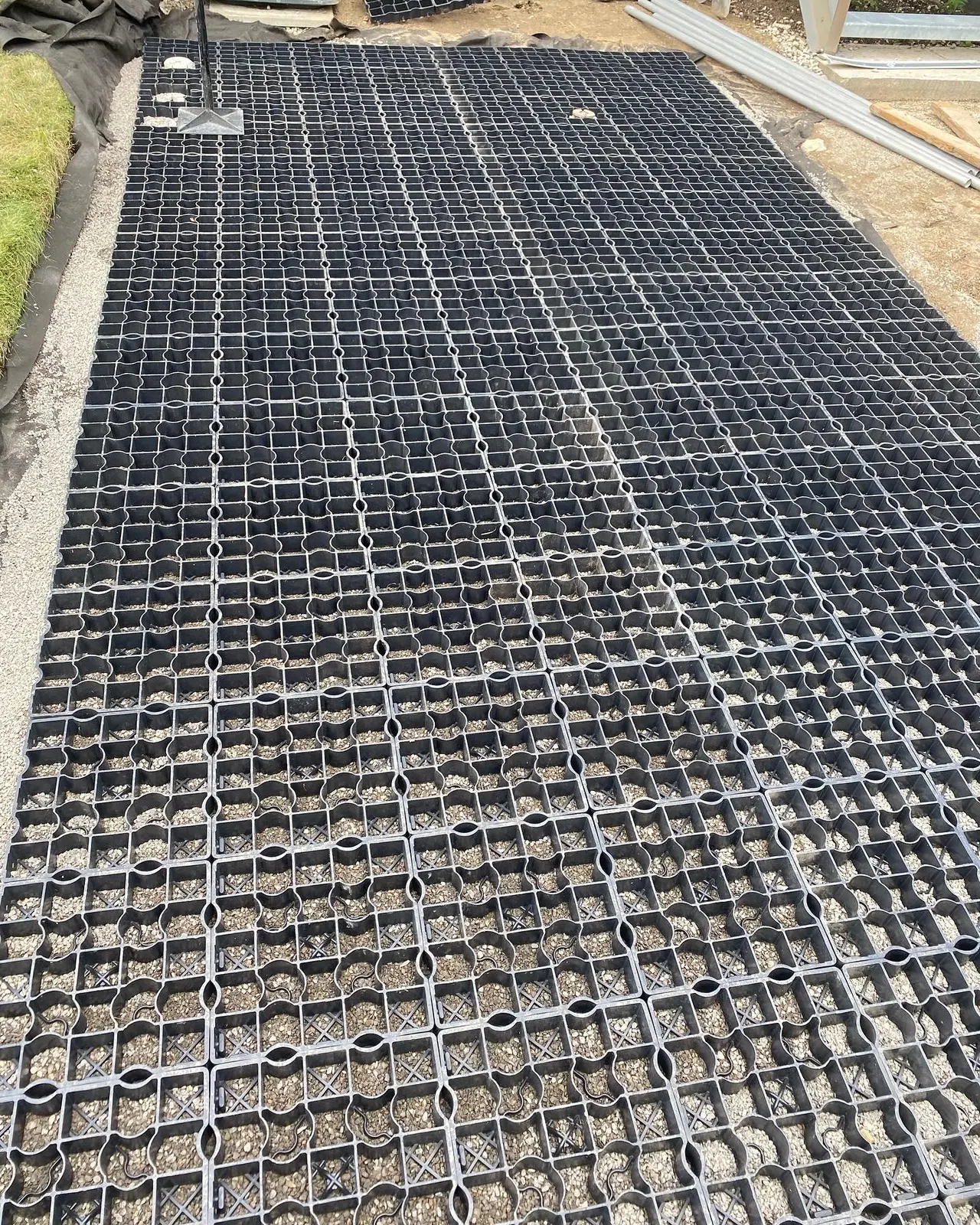 Ecoraster grid installation on gravel base for permeable driveway