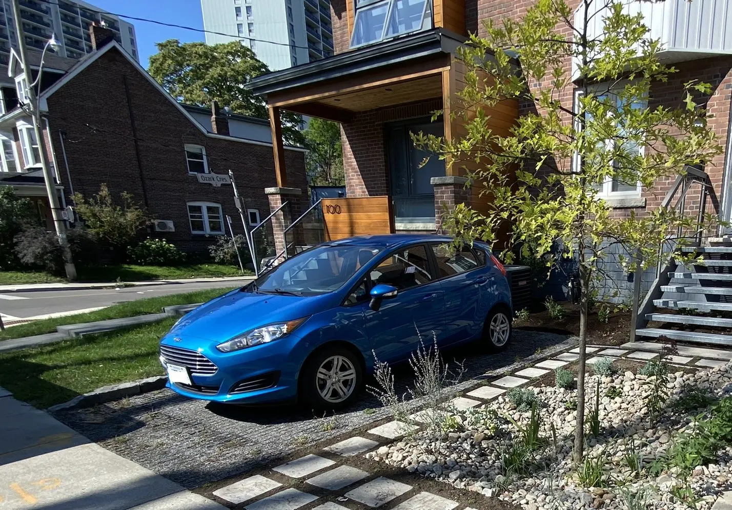 Completed Ecoraster permeable front driveway with urban landscaping