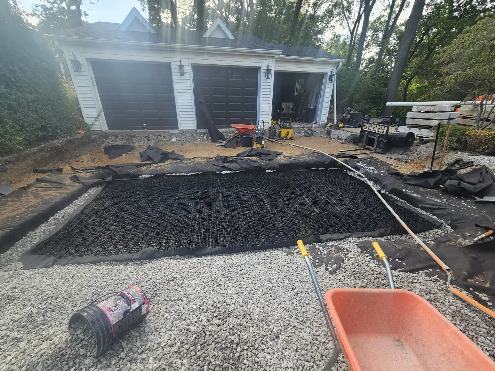 Infiltration trench with Ecoraster grid & geotextile fabric at garage